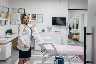 A confident man showcasing youthful, smooth skin after treatment.