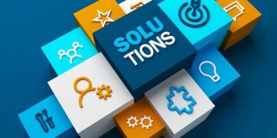 3D cubes with icons surrounding the word 'SOLUTIONS'.