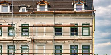 Building facade under renovation with scaffolding.