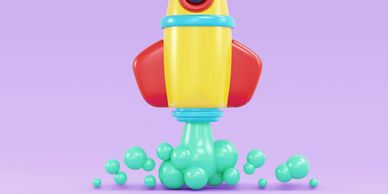 Colorful cartoon rocket with bubbles on a purple background.