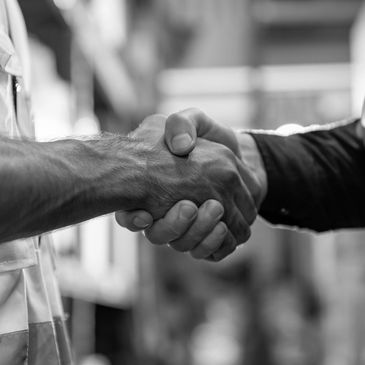 Two civil engineers shaking hands.