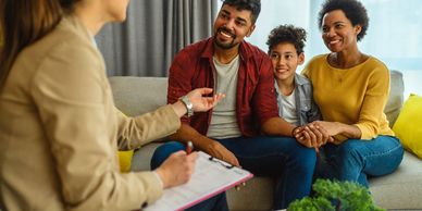 Counselor in session with a family