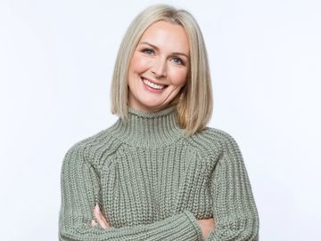 woman in owasso excited to complete hormone pellets in Owasso at Pathway Health and Beauty