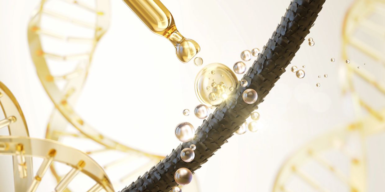 Golden serum drops on a textured black strand with DNA helix background.
