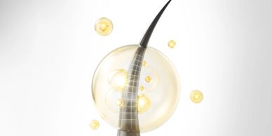 Concept image for advanced hair care, showing a healthy hair strand with bonding technology bubble.