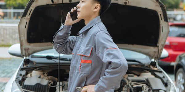 Technician providing on-site auto repair.