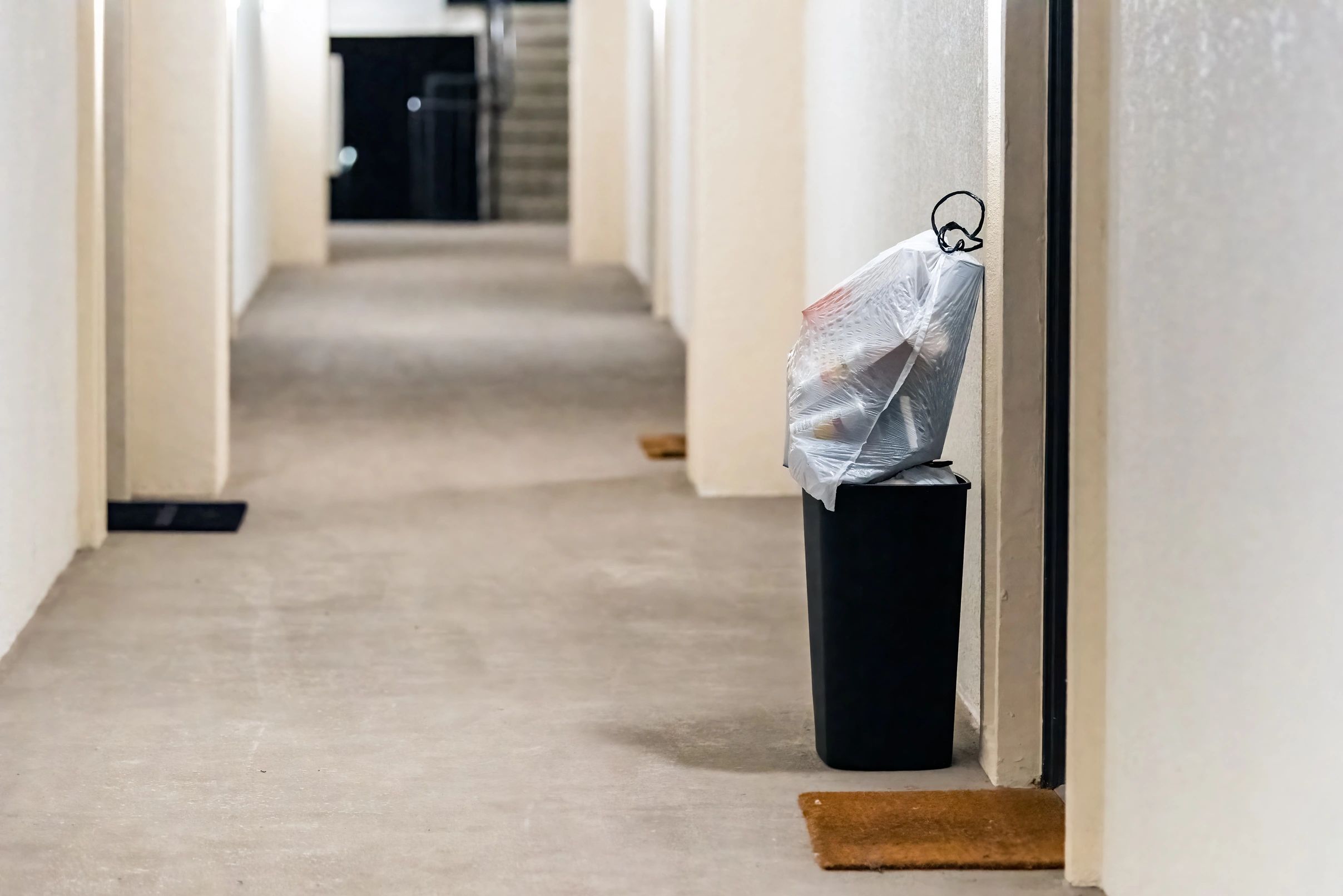 trashcan outside apartment door