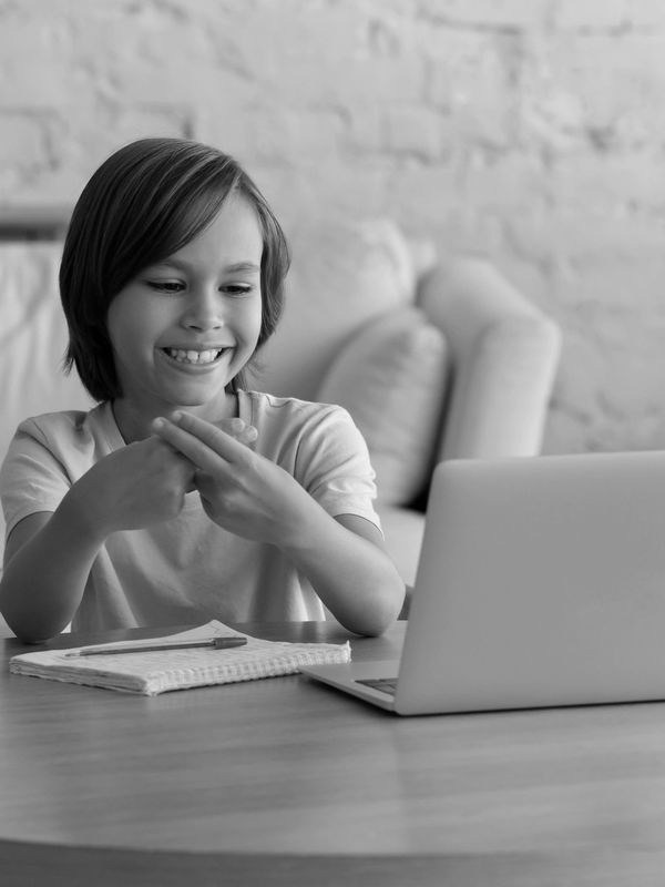 child doing telehealth therapy