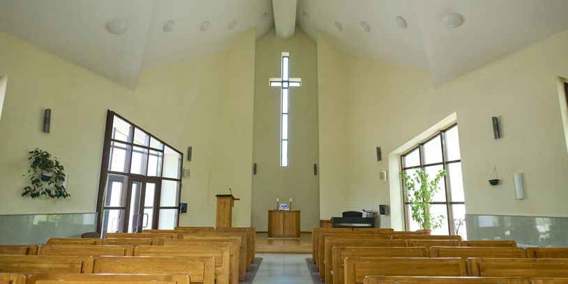 Angel-themed baptism scene in the church.