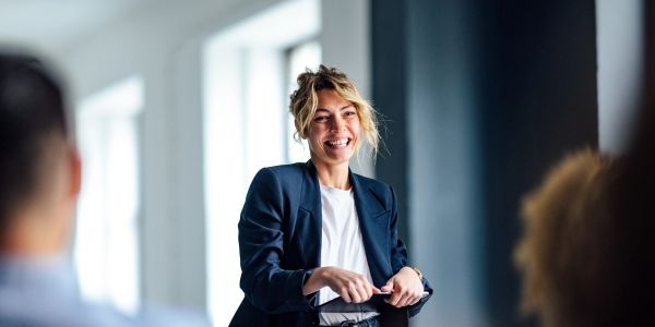 Woman speaking confidently in a meeting.