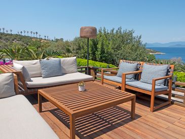 Woven rattan chair with wooden frame.