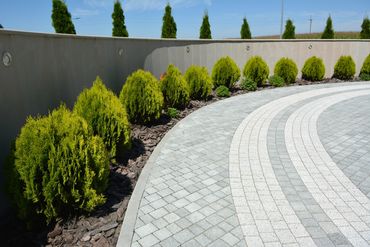 Smoothing new sidewalk concrete