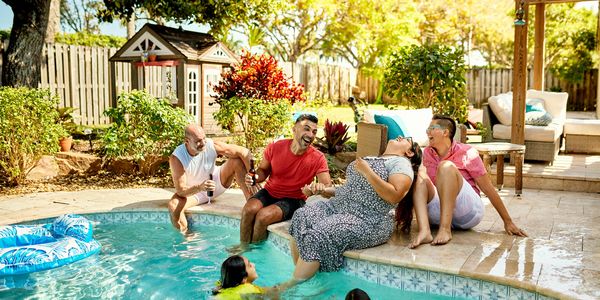 Florida family enjoying a clear, swim-ready backyard pool.