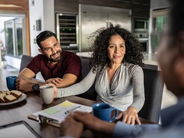 Couple discussing with a professional.