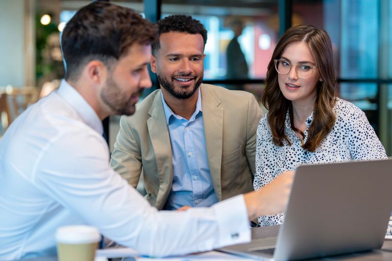 Financial advisor or lawyer with couple explaining options