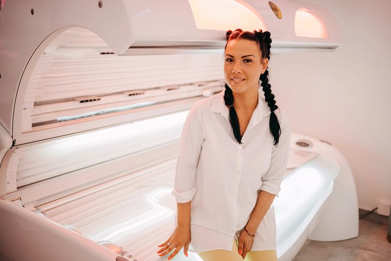 Worker prepares a solarium for sunbathing
