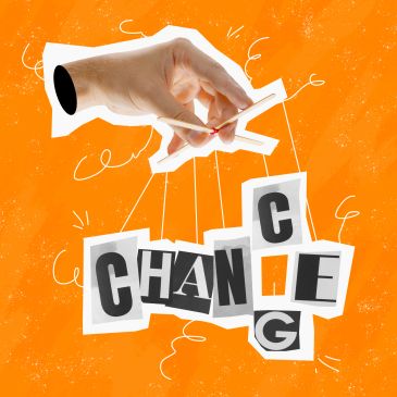 Hand manipulating letters spelling "CHANGE" like a puppet.
