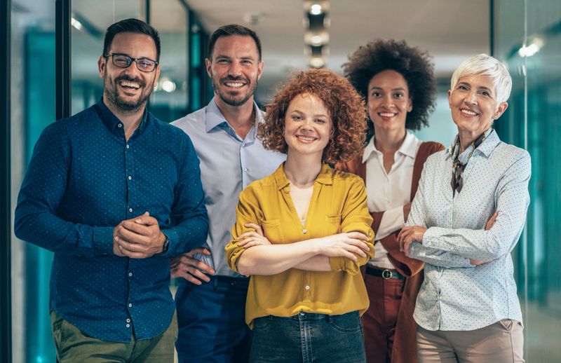 Portrait of Modern multi ethnic business team standing and looking at camera