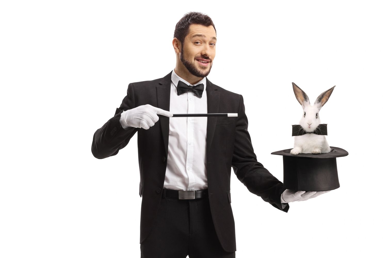 Magician in tuxedo holding a wand and a hat with a rabbit inside.