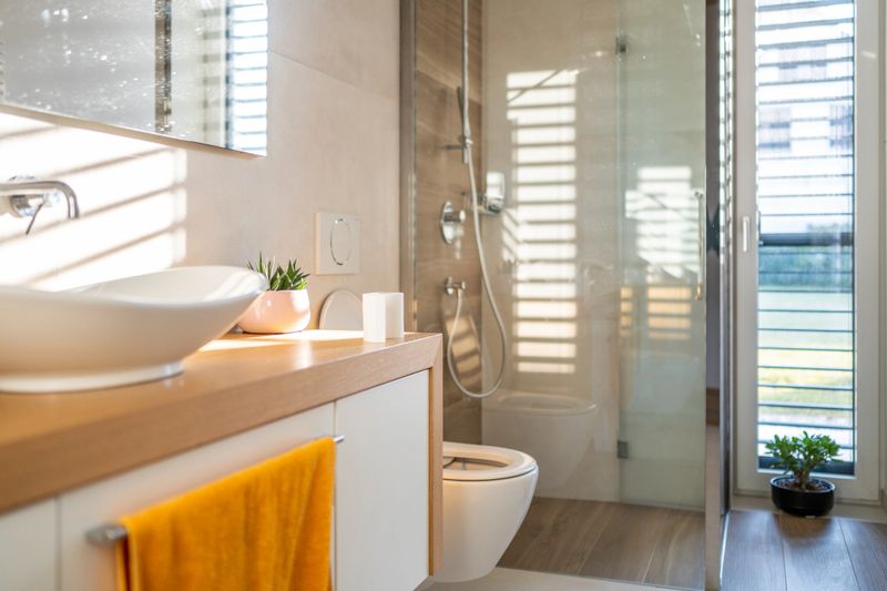 Interior view of domestic bathroom with bathroom sink and toilet.