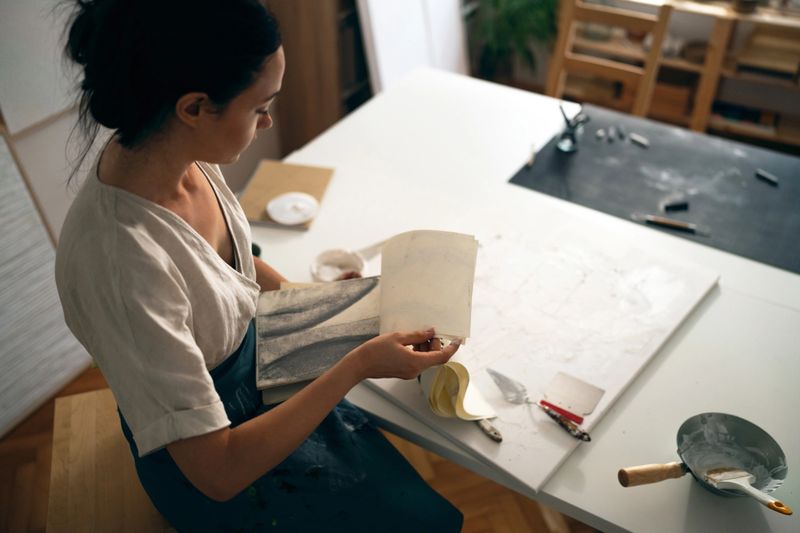 Portrait of young female artist in her studio.