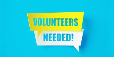 Bright speech bubbles say 'Volunteers Needed!' on a blue background.