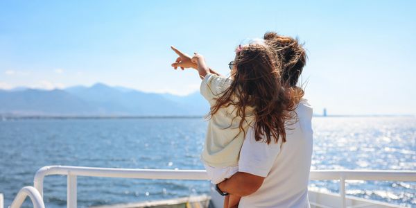 people standing on ferry deck to Dunoon