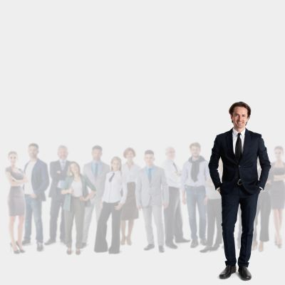 Confident businessman standing in front of a group.