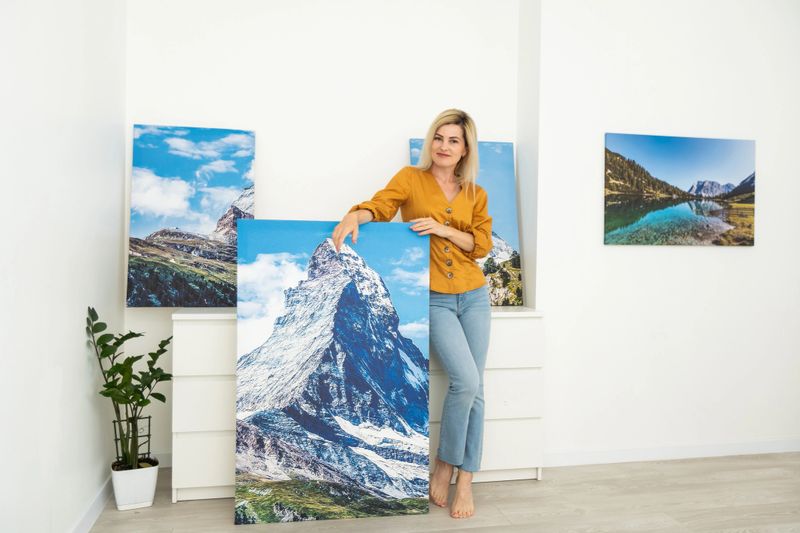 Canvas prints. woman holding photo canvas.