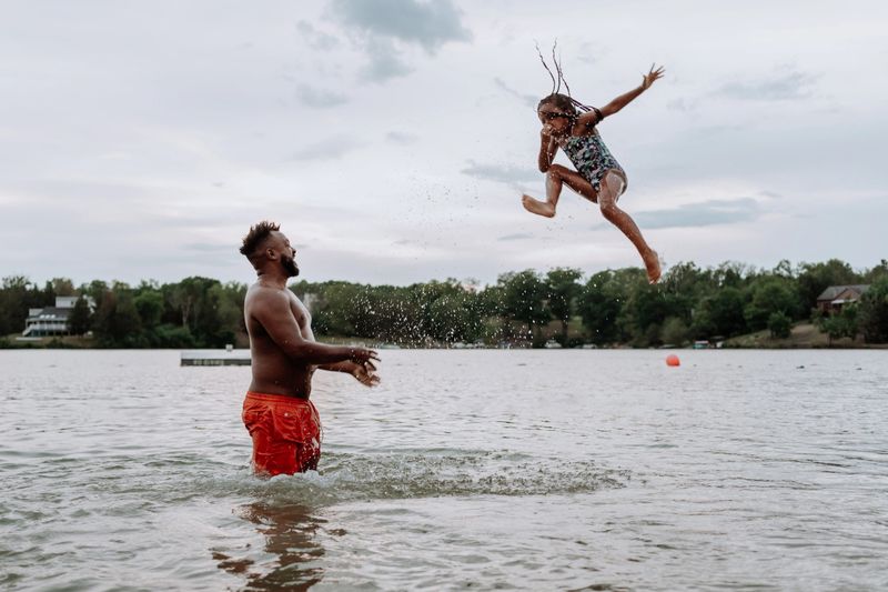 family having fun at the lake
