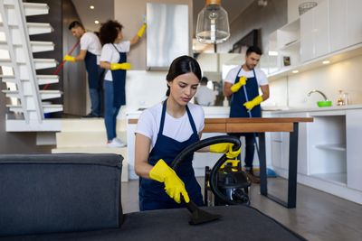 A cleaning crew working in a home