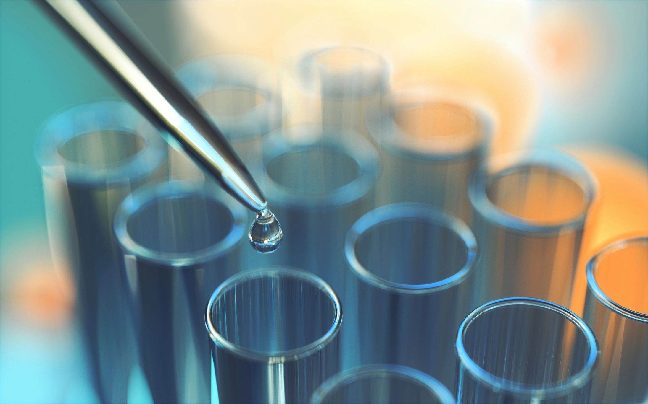 Pipette dispensing liquid into research peptide vials in a laboratory