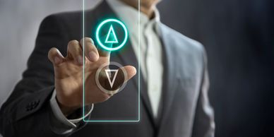 Businessman interacting with a futuristic touchscreen interface.