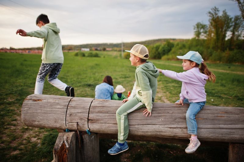 Children having fun together at meadow.