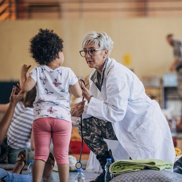 Doctor examining a child in a clinic.