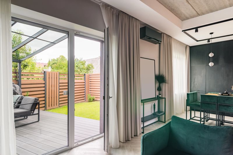 Large windows, fully opening to go outside to outdoor terrace, straight from the living room.