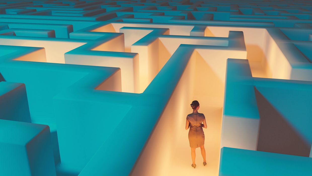 Person navigating a glowing maze.