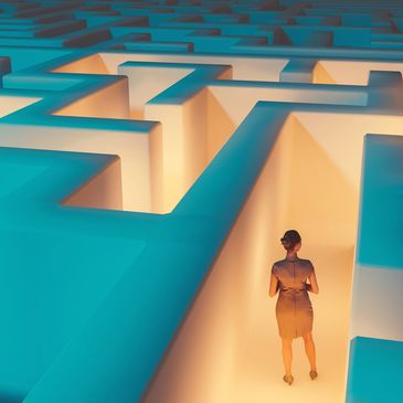 A woman stands at the start of a glowing maze, contemplating her path.