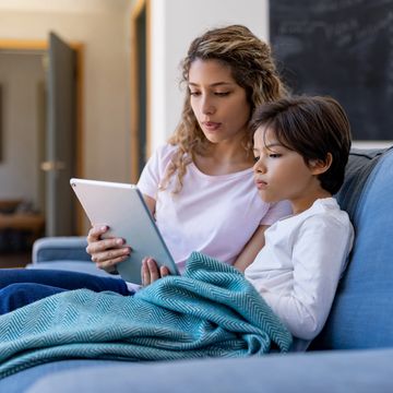 Image of woman and child holding a tablet device