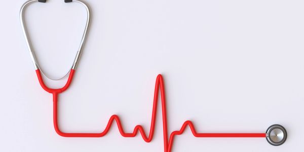 Stethoscope forming a heartbeat line on a white background.