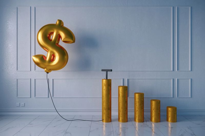 Pumped golden balloon shaped of dollar sign with the growing bar graph on white wall, symbolizing inflation concept. (3d render)