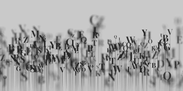Letras negras dispersas sobre fondo gris.