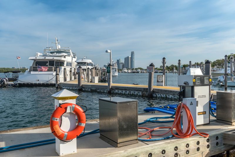 Yachts in the marina of Haulover Park and in the background are the new skyscrapers of Sunny Isles Beach in Miami, Florida.