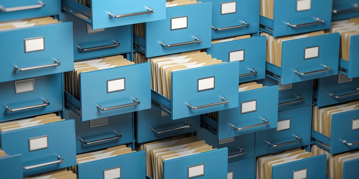 a series of blue filing cabinets, all  partially left open.
