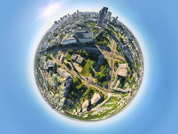 A tiny planet view of an urban cityscape with buildings and roads.
