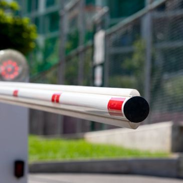 Close-up of a parking barrier gate arm.