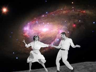 A couple dancing against a cosmic galaxy backdrop.
