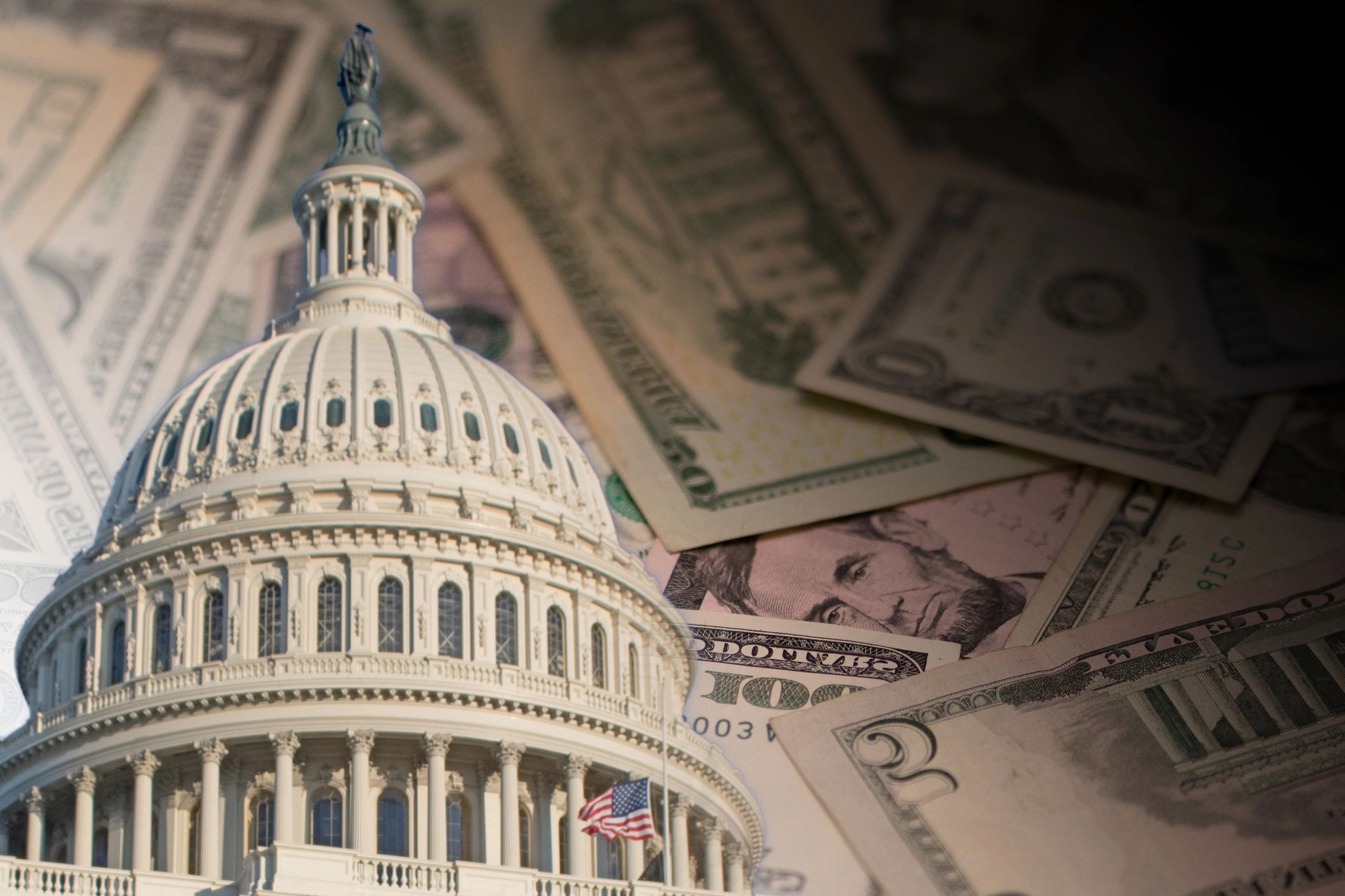 US Capitol dome with overlay of US dollar bills.