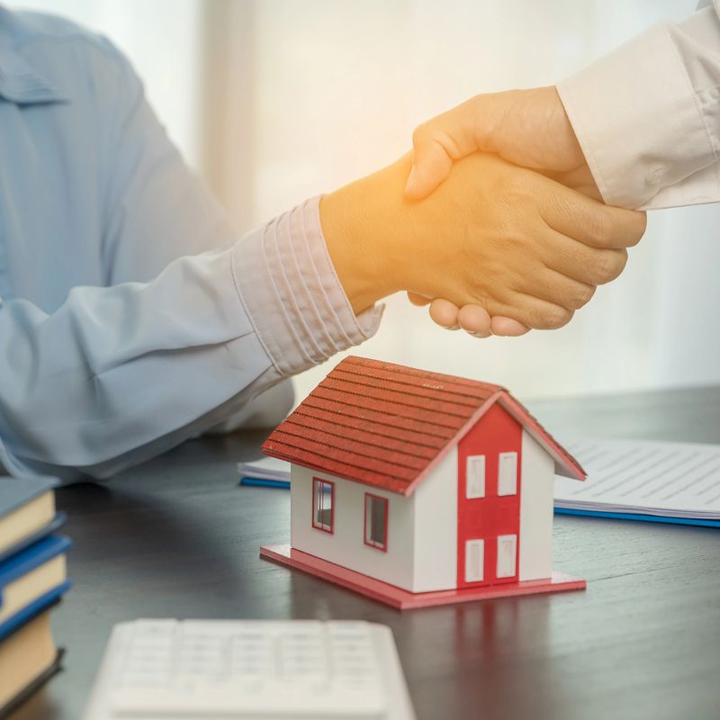 Estate agent shaking hands with client after contract signature and done business deal for transfer right of property. Man broker Real Estate Agent real estate agent shake hands of happy clients homeowners