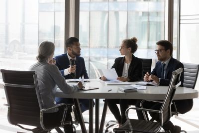 Four professionals in a meeting.